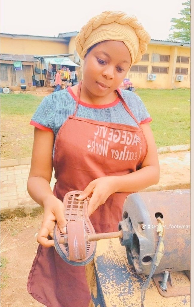 Mrs Falilat at work, smoothening shoe soles. Credit her X page (formerly Twitter)