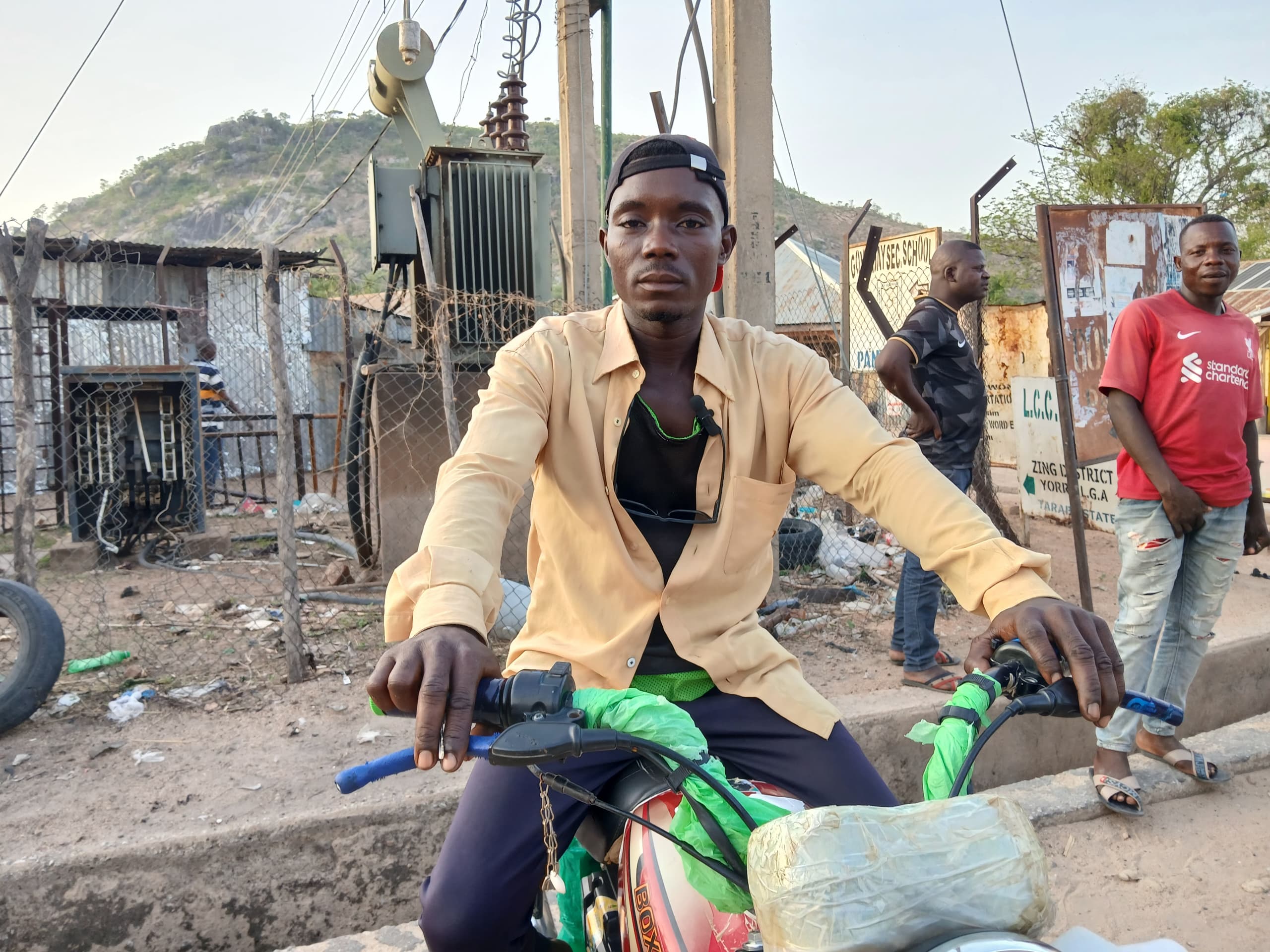 Even though the road construction project had stalled, Nuhu believes that he will live long to transport passengers and goods with ease on the road. Photo. Yahuza Bawage.