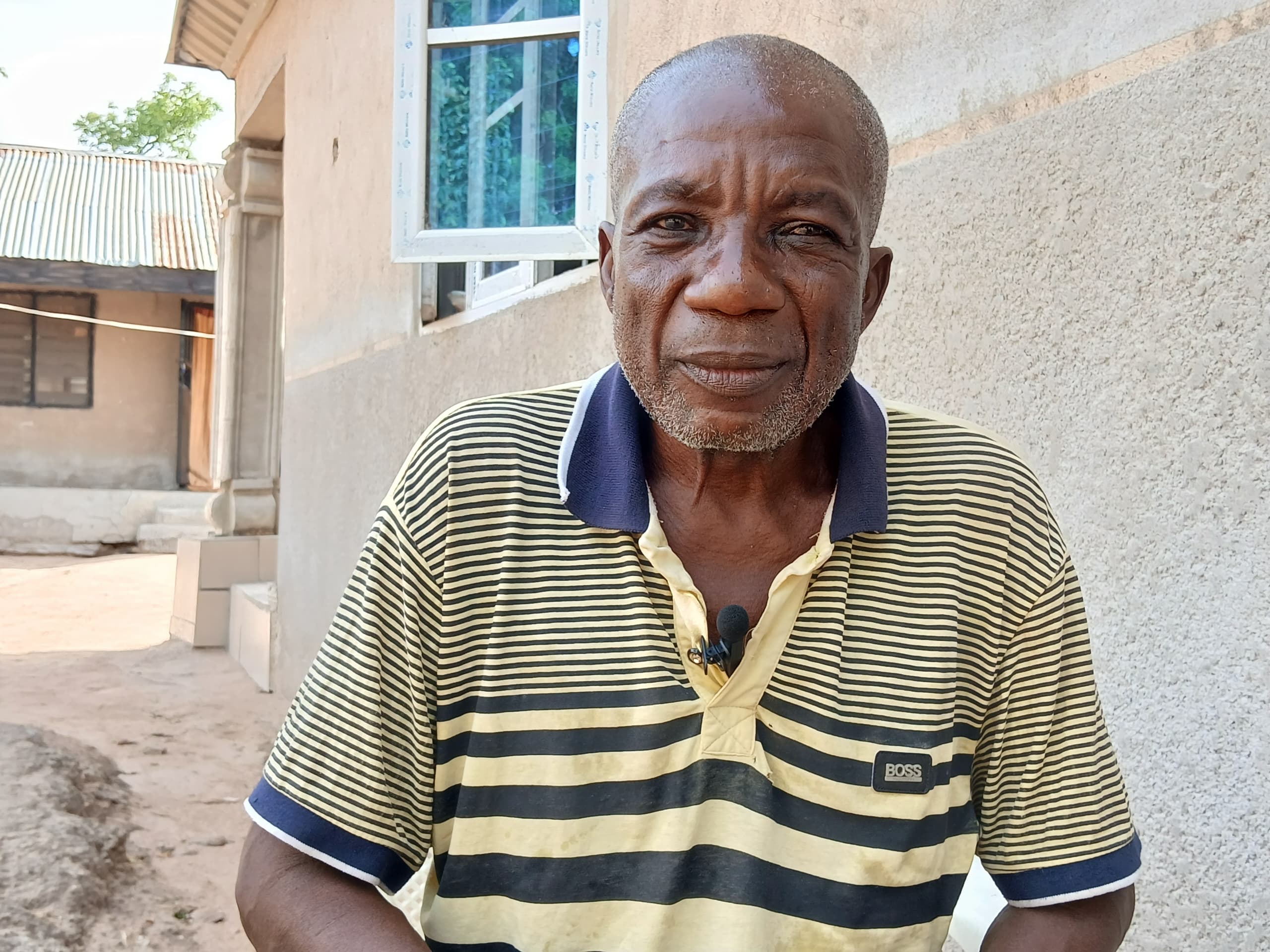 Iliyasu Makong is one of the community chiefs who witnessed the kick off of the road project in 2017. Photo Yahuza Bawage.