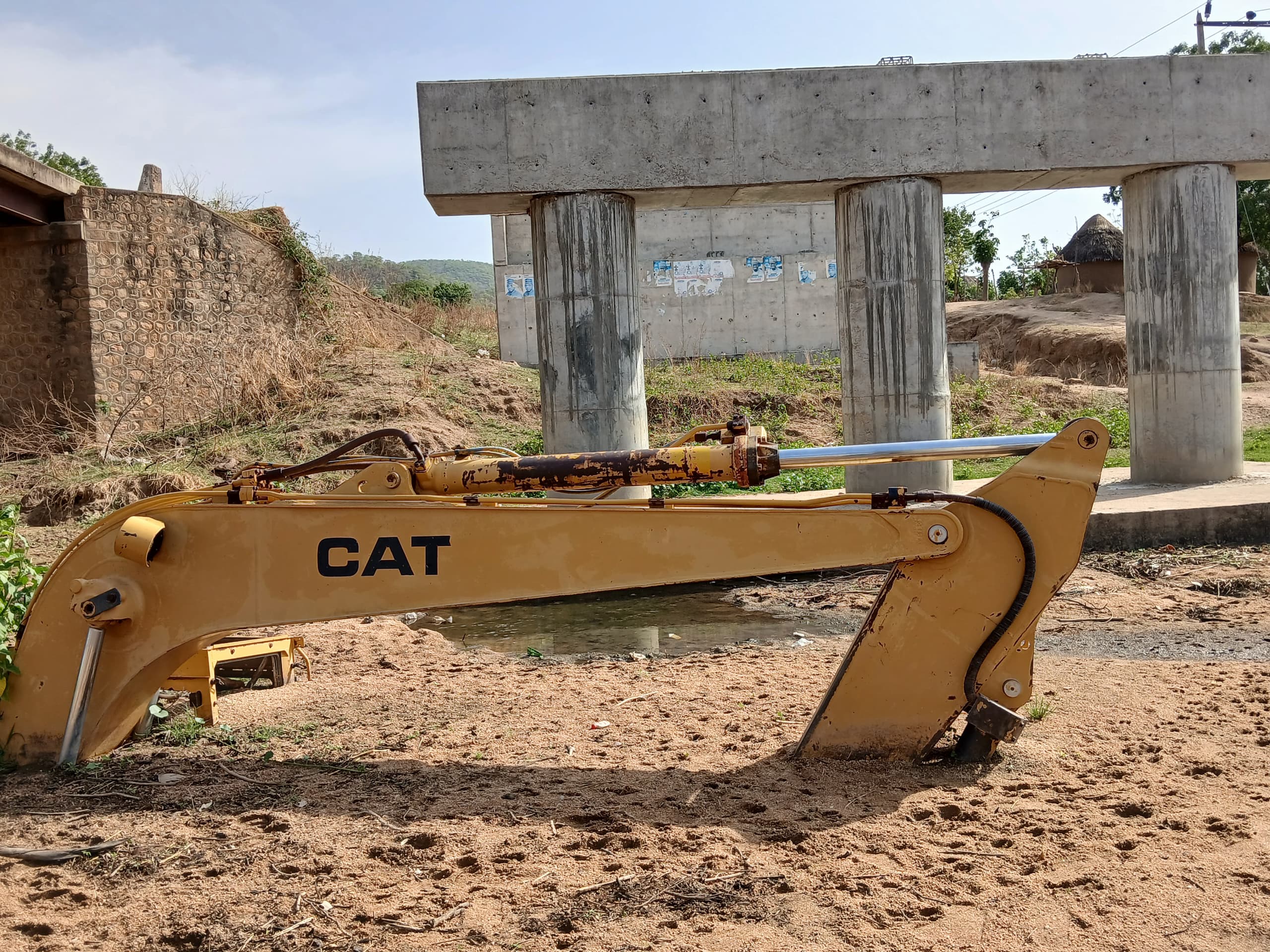 This excavator was stuck in the riverbed in Lacheke when this reporter visited in April. Photo Yahuza Bawage.