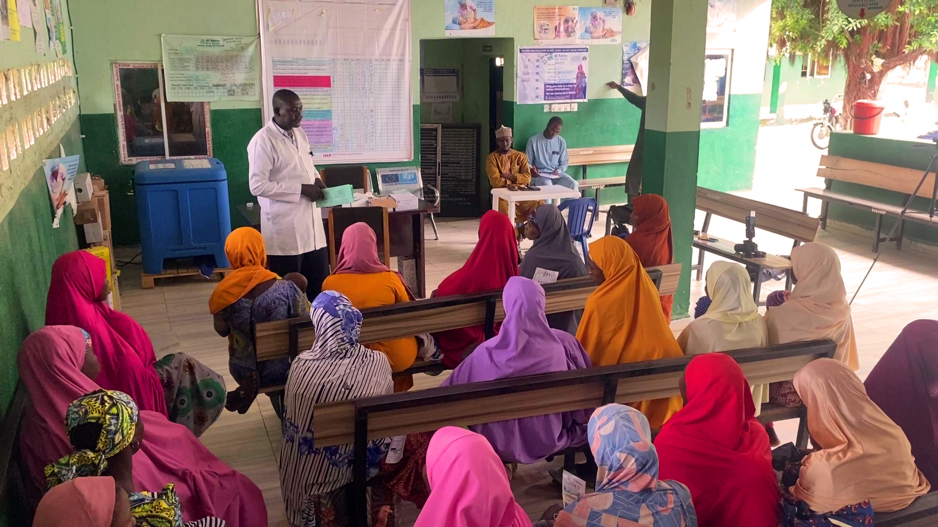 Saleh Garba Muhammed the routine immunization officer at the Durum PHC addressing mothers at the facility. Photo Credit: Ogar Monday/Prime Progress