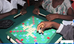 Mercy and her friends playing a game of Scrabble. Photo credit: CWEENS