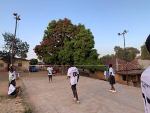 YPCO team practicing in the makeshift badminton court.