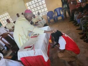 Bishop Isaac Dugu praying for Fullfire. Photograph: Courtesy of Manasseh Mbachii Bishop Isaac Dugu praying for Fullfire. Photograph: Courtesy of Manasseh Mbachii