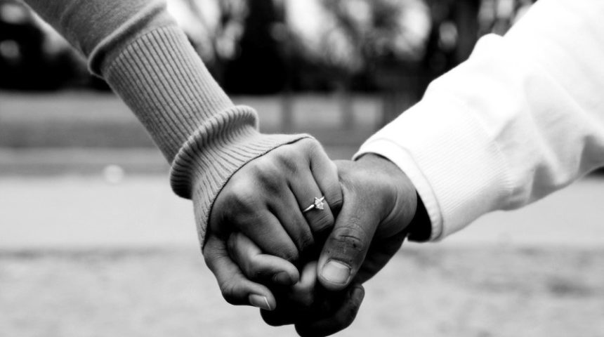 Black Couple Holding Hands