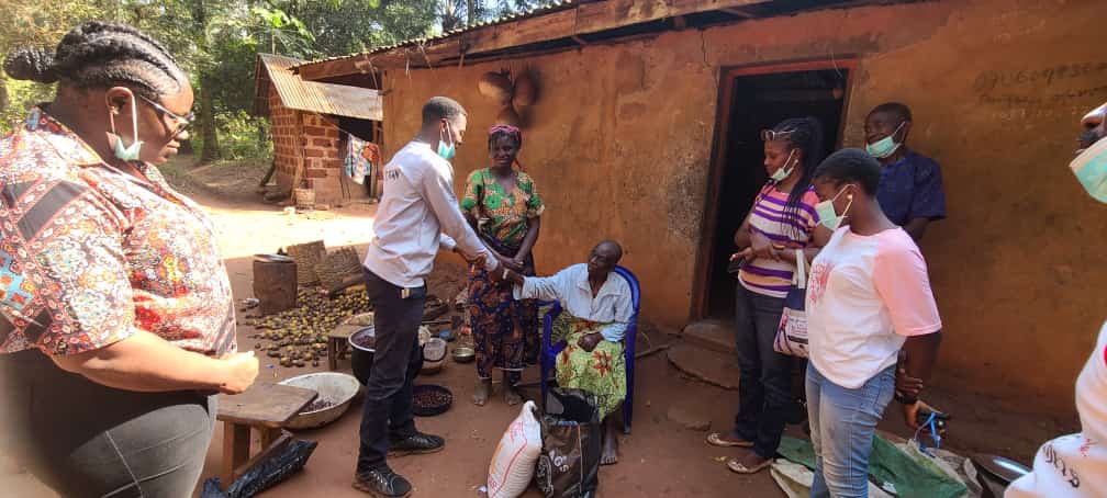 Soul Touchers Outreach doling out rice and others to excited beneficiaries in Amalla Egazi area of Enugu State