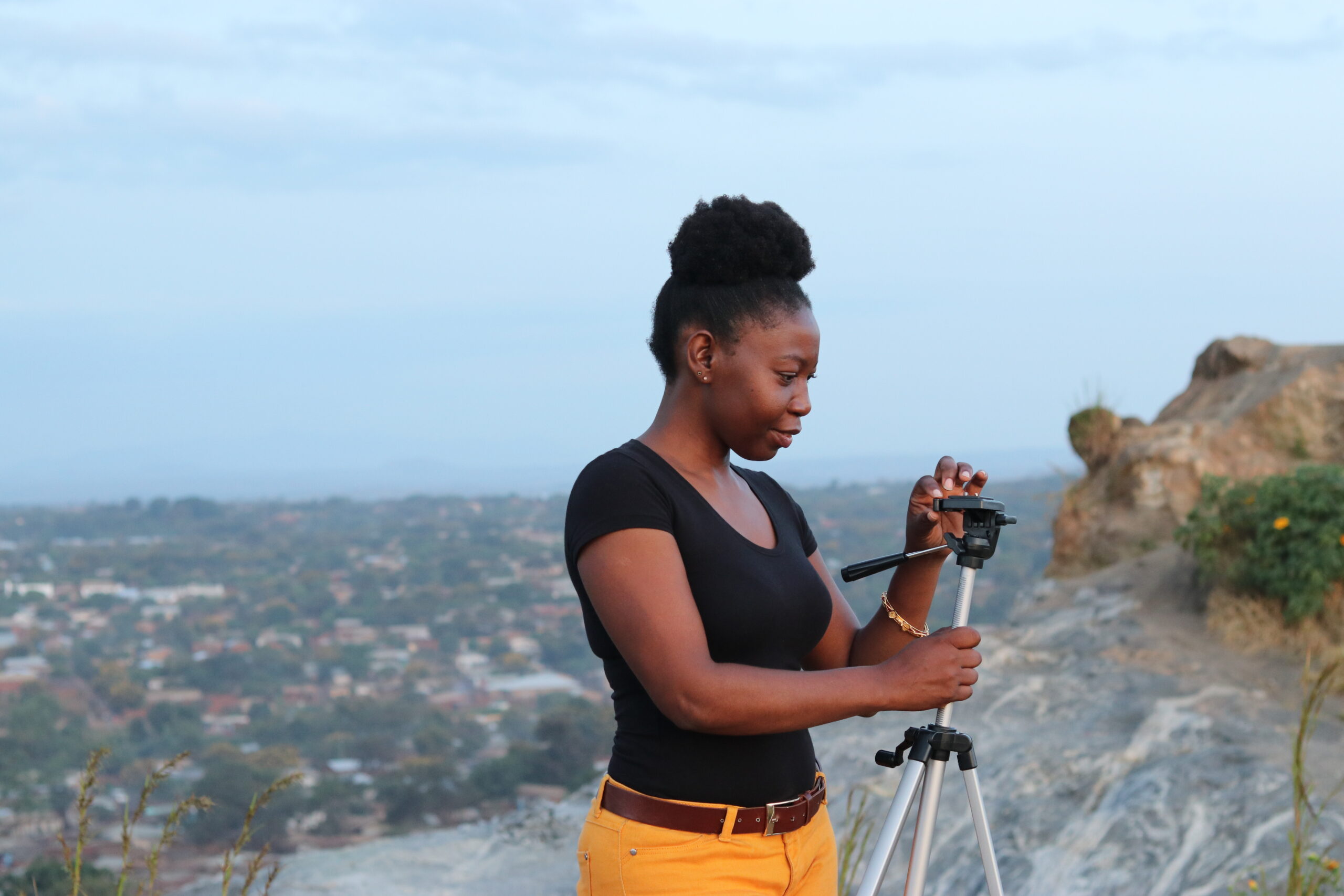 Angela Jimu preparing a tripod while in the field in Lilongwe