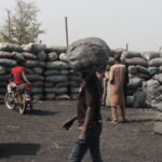Bags containing charcoal stacked in a site. Photo credit: Ekpali Saint