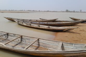 Traditional canoes used by Gambo and his colleagues to ferry passengers and goods. Photo Credit Yahuza Bawage for Prime Progress.