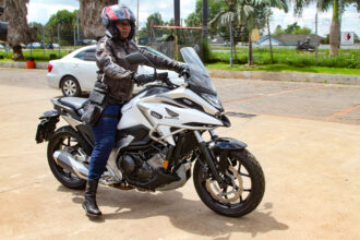 Evonne Mudzingwa rides her motorbike in Harare, Zimbabwe, on January 28, 2024. Photo credit: Mike Saburi, bird story agency