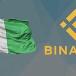 A Nigerian flag and Binance's mascot
