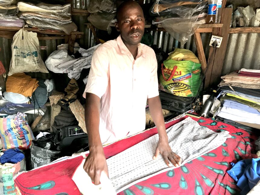 Musa Jarou in his laundry shop. Photo credit: Rejoice Taddy for Prime Progress