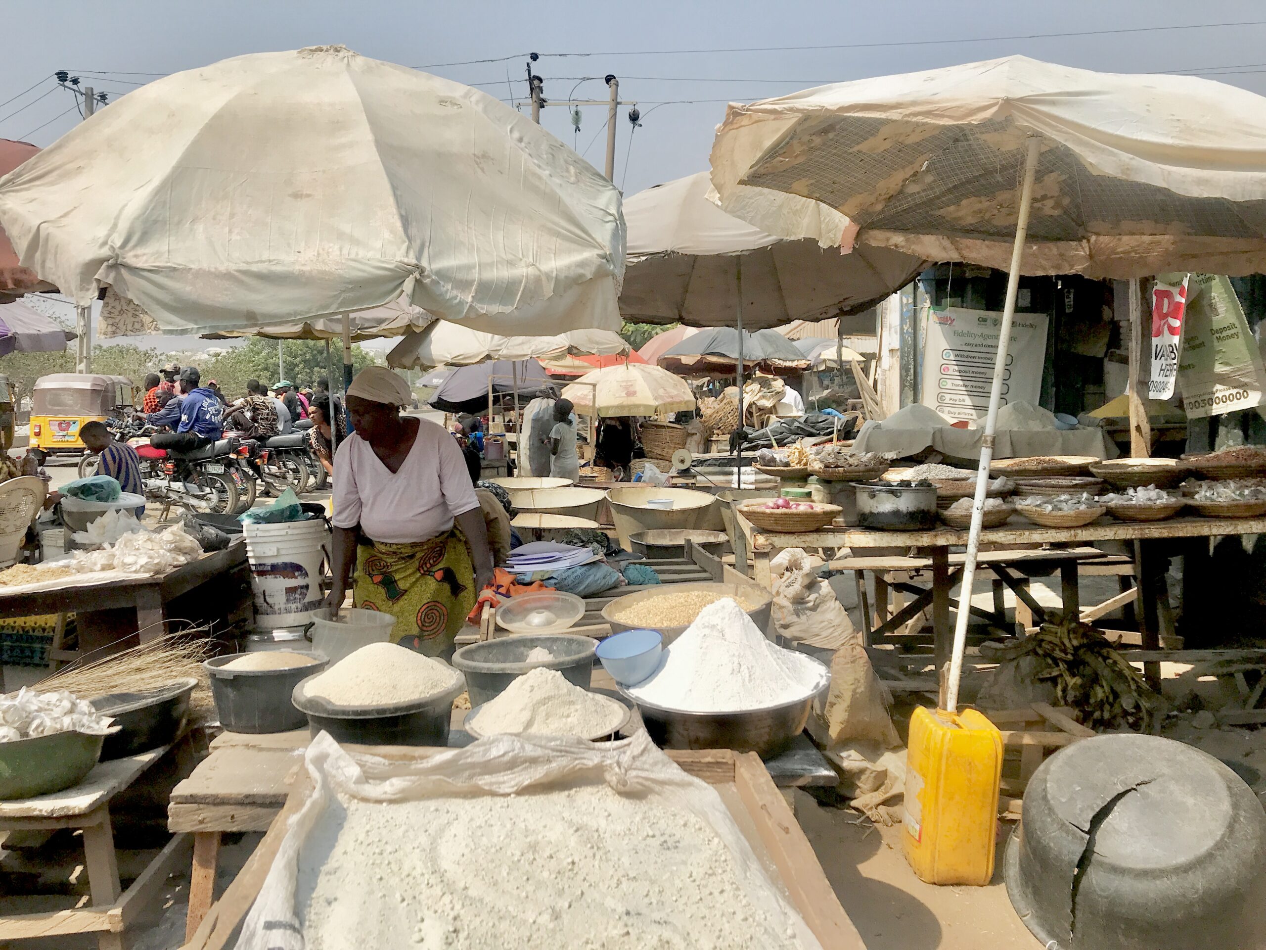 A woman selling her ware in the Ajata market. Photo Credit: Rejoice Taddy/ Prime progress