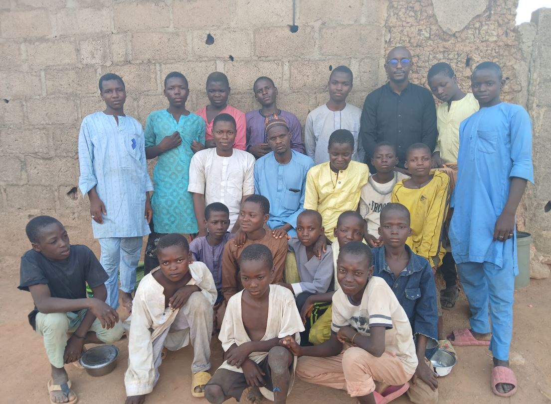 Ciroma and the Almajiri children have become friends over the years. Photo credit: Yahuza Bawage.