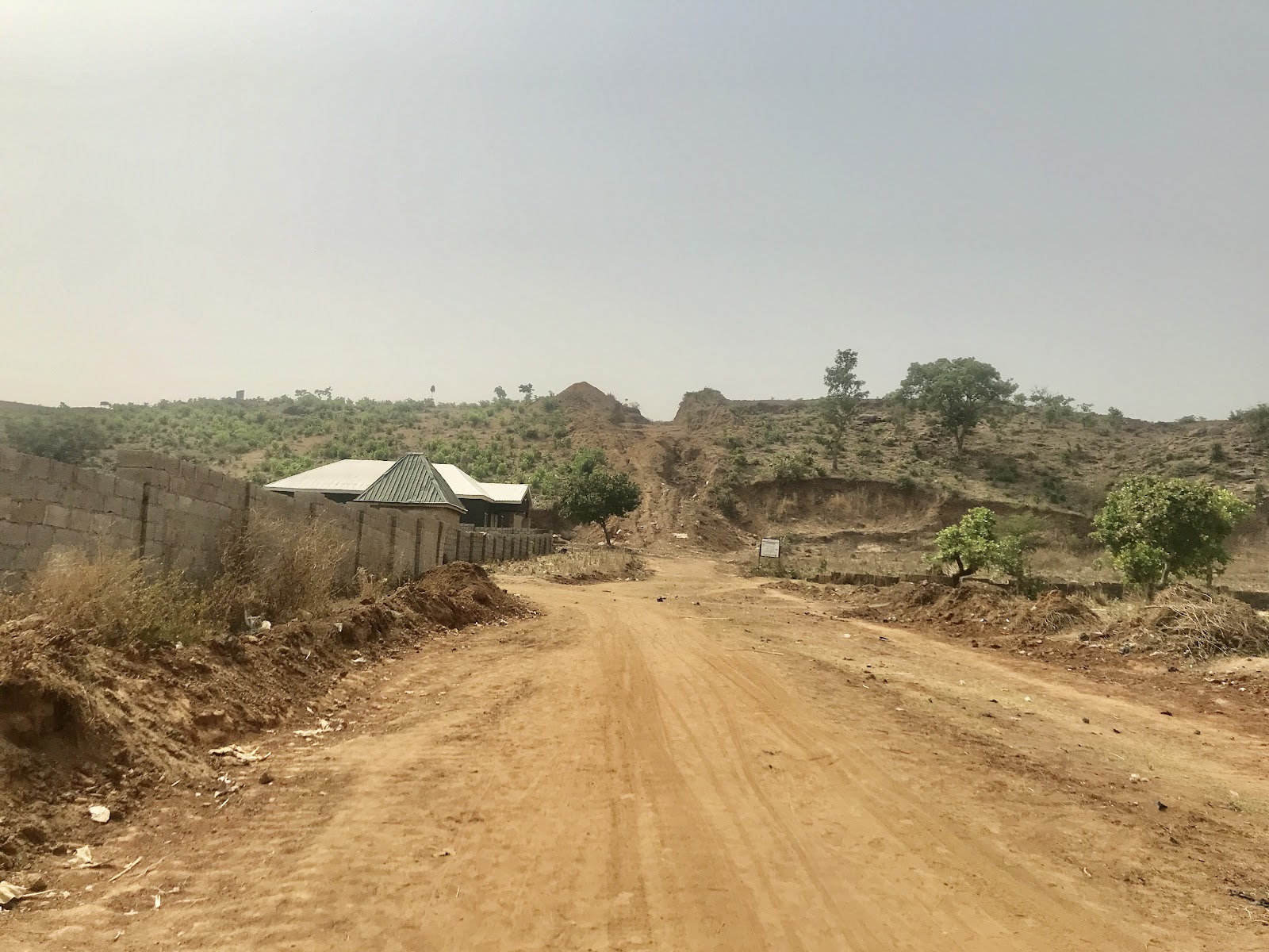 An empty field gradually cleared by landowners for construction. Photo credit: Rejoice Taddy.