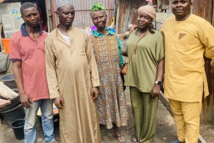 Mr Kazeem posing with friends and family. Photo credit: X