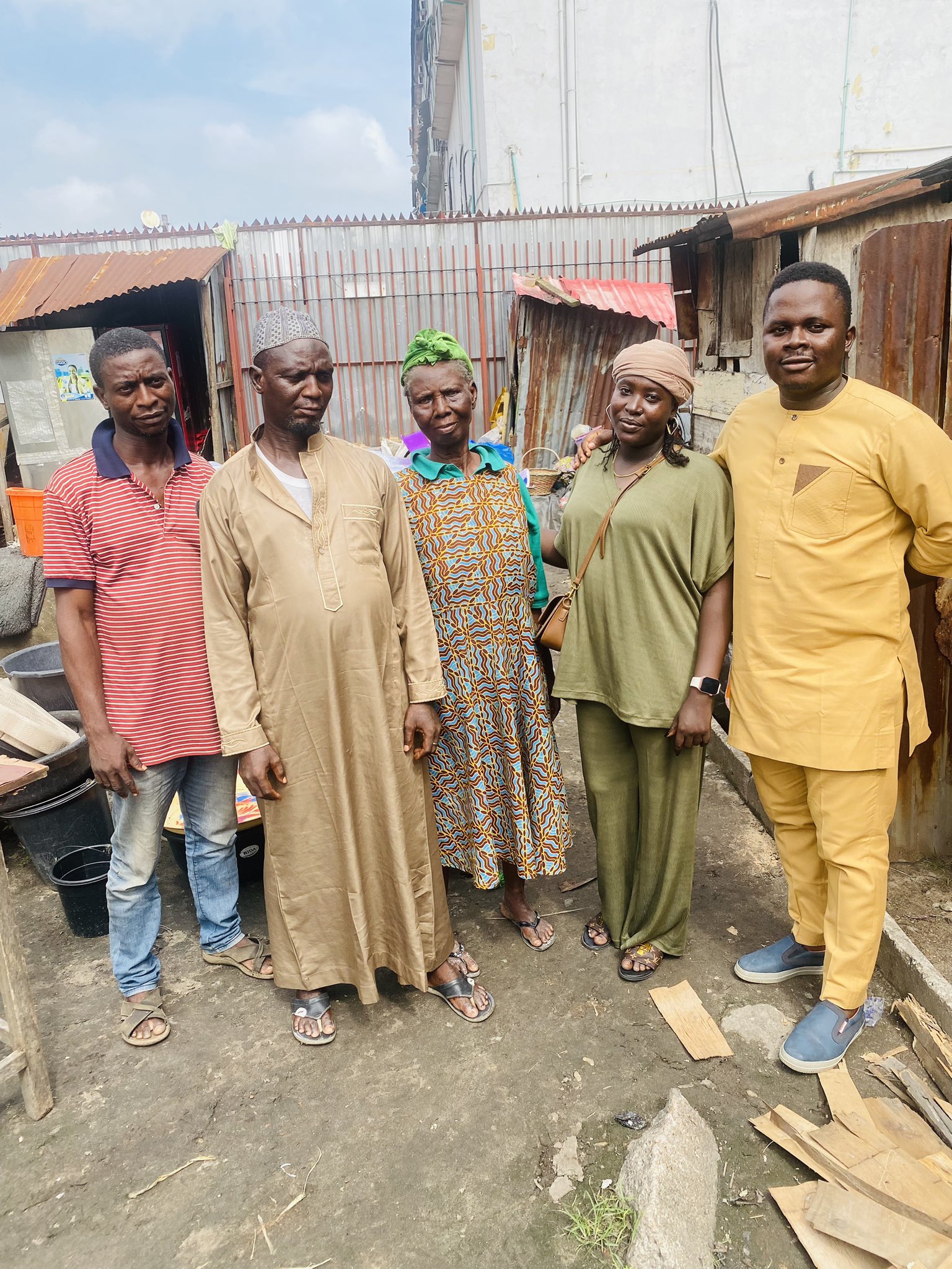 Mr Kazeem posing with friends and family. Photo credit: X