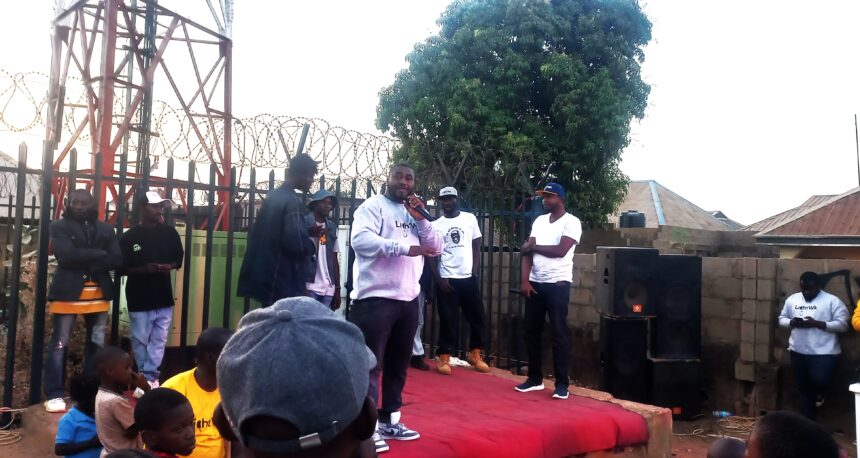 Jeremiah Aluwong addresses the audience before a battle rap begins in Romi, a suburb in Kaduna, on Feb. 14, 2024