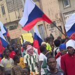 Protesters waving Russian flags at the recent Hunger protests in Nigeria. Photo credit: Nairametrics