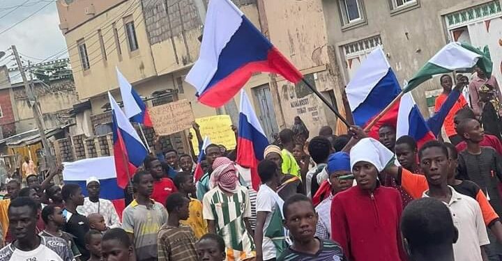 Protesters waving Russian flags at the recent Hunger protests in Nigeria. Photo credit: Nairametrics