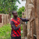 Nuhu Abdullahi said he would not rest until he and his siblings rebuilt their home. Photo credit: Ahmed Abubakar Bature.