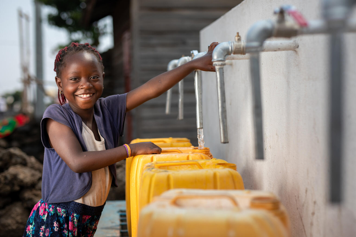 A girl fetching water from a tap. Photo Credit: UN Photo/Gwenn Dubourthoumieu (The Photo is use for illustration purpose)