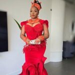 Yemi Alade accessorized with coral beads on her neck and wrists, in a nod to a Benin bridal attire.