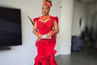 Yemi Alade accessorized with coral beads on her neck and wrists, in a nod to a Benin bridal attire.