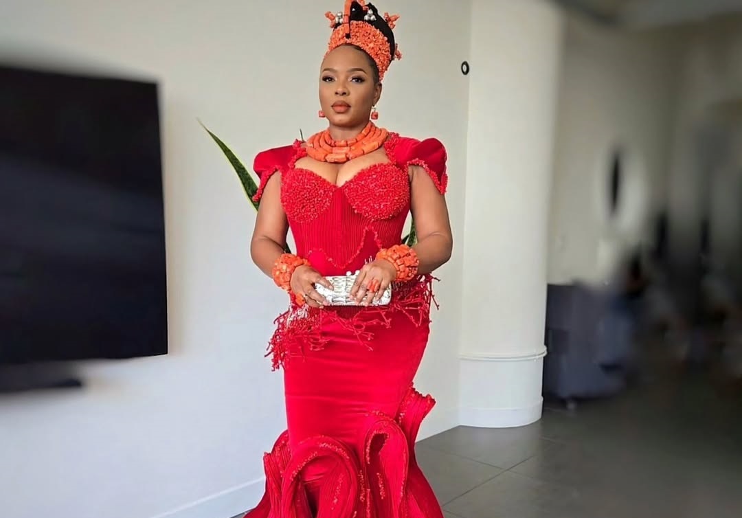 Yemi Alade accessorized with coral beads on her neck and wrists, in a nod to a Benin bridal attire.