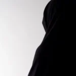 A widow in black clothing