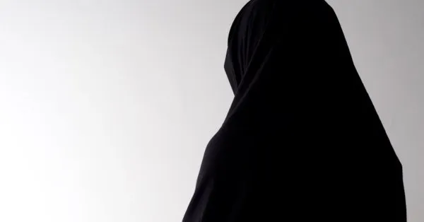 A widow in black clothing