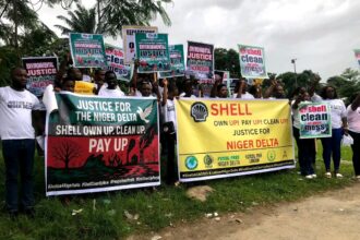 Youths with banners decrying pollution in the Niger Delta. Photo credit: Lekeh Development Foundation