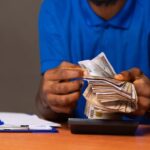 Nigerian man counting money
