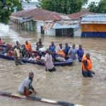 people affected by floods are escorted through flood water on a military boat in maiduguri on september 12 2024 severe floodin