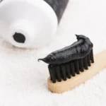 toothbrush black charcoal toothpaste 167463664