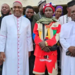 Catholic Priests Isaac and Michael with Overall Konyo in Katsina Ala. Photograph: Courtesy of Manasseh Mbachii