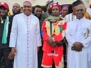 Catholic Priests Isaac and Michael with Overall Konyo in Katsina Ala. Photograph: Courtesy of Manasseh Mbachii