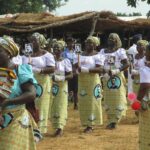 A clutch of Nigerian women dressed in traditional uniform dress. Credit: Web