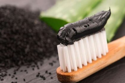 Charcoal toothpaste on a brush. Credit: Sourced from web
