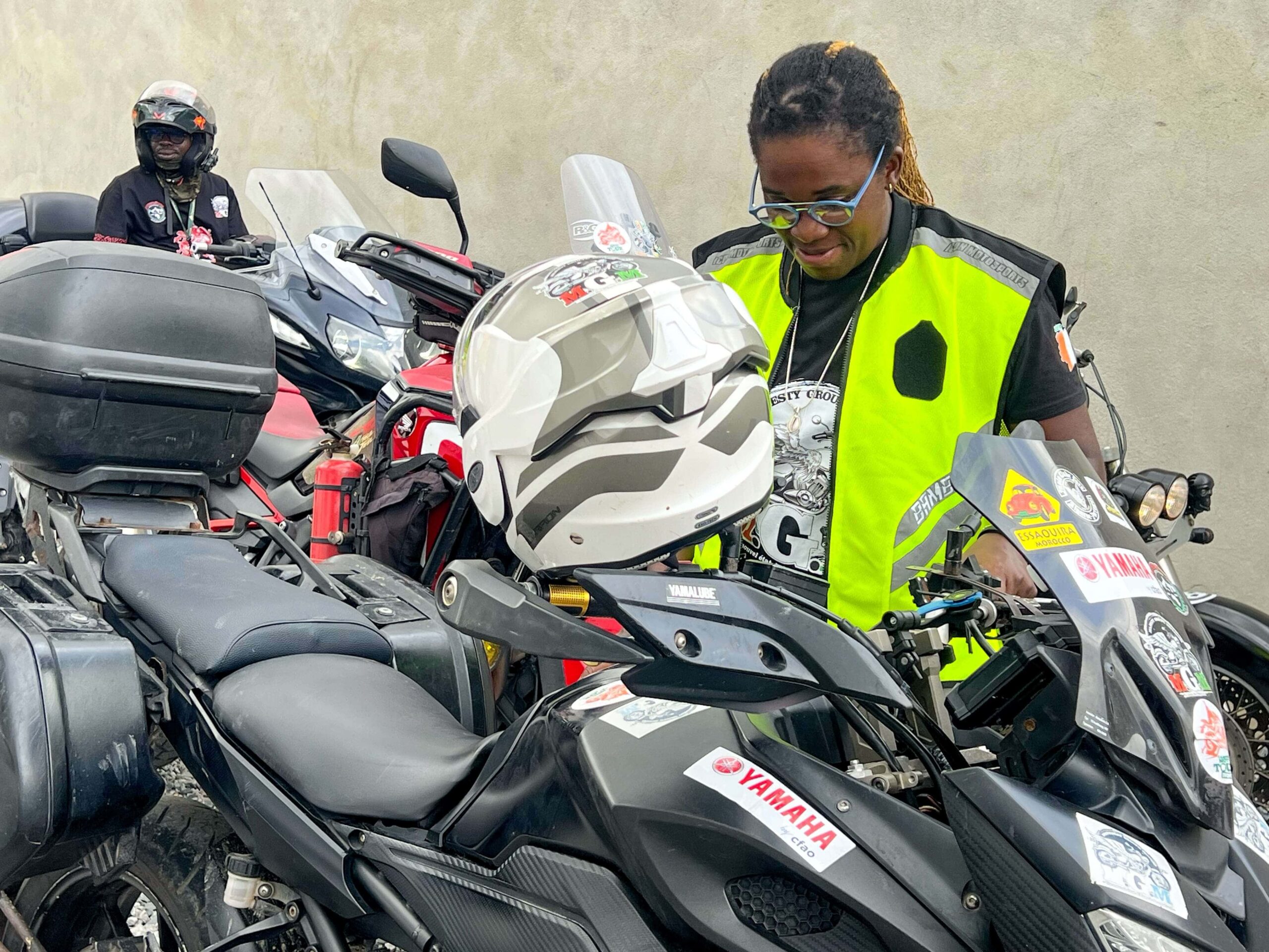 Bamba Édith Christine, President of the National Federation of Motorcycle Clubs and Related Organizations of Ivory Coast, preparing for a motorcycle race in Abidjan-Cocody, Credit: bird story agency