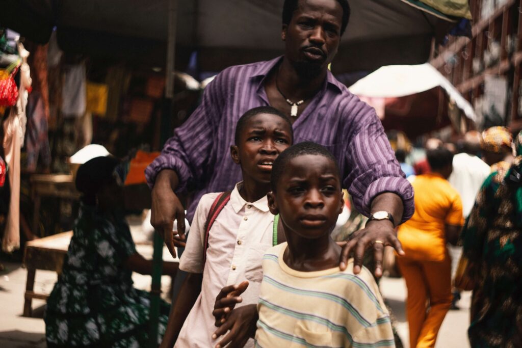 A still from My Father’s Shadow showing Ṣọpẹ́ Dìrísù as Folarin the father of Chibuike Marvellous Egbo and Godwin Egbo. Photo courtesy: MUBI.